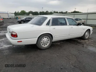 1999 Jaguar XJ with VIN SAJKD6041XC876928, listed as a Copart auction lot 60038405 with 63,917 mi miles and Clean title. Bid and sale history available at DreamBid. Image 3.