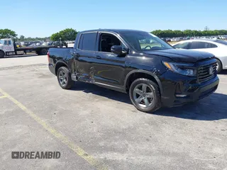 2022 Honda Ridgeline RTL z VIN 5FPYK3F50NB016717, wystawiony jako IAAI lot #41836197 z przebiegiem Nie podano mil oraz . Historia ofert i sprzedaży dostępna na DreamBid. Obrazek 1.