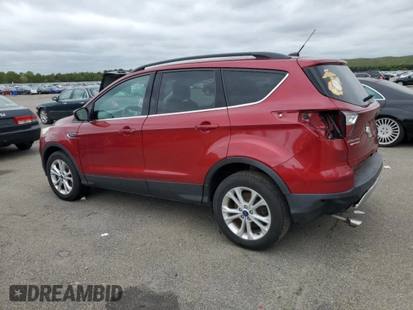 2018 Ford Escape SE z VIN 1FMCU9GD7JUB01668, wystawiony jako Copart lot #57038675 z przebiegiem 70 780 mil mil oraz Szkoda całkowita • Salvage title. Historia ofert i sprzedaży dostępna na DreamBid. Obrazek 2.