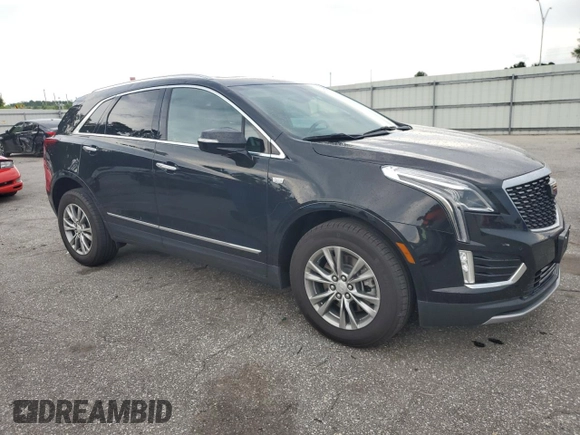 2023 Cadillac XT5 AWD Premium Luxury with VIN 1GYKNDRSXPZ145763, listed as a Copart auction lot 58387365 with 51,368 mi miles and Salvage title. Bid and sale history available at DreamBid. Image 4.