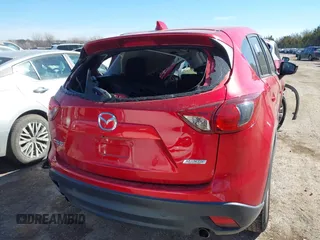 2014 Mazda CX-5 Touring z VIN JM3KE2CY2E0364488, wystawiony jako IAAI lot #41635188 z przebiegiem 127 688 mil mil oraz . Historia ofert i sprzedaży dostępna na DreamBid. Obrazek 16.