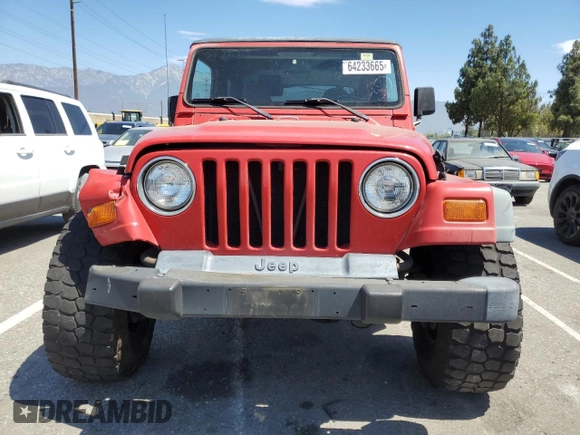 1999 Jeep Wrangler Sport with VIN 1J4FY19S7XP401120, listed as a Copart auction lot 64233665 with 129,708 mi miles and Salvage title. Bid and sale history available at DreamBid. Image 5.