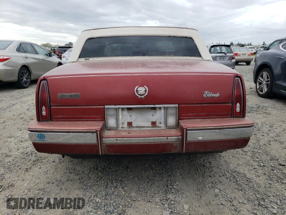 1986 Cadillac Eldorado z VIN 1G6EL5784GU616263, wystawiony jako Copart lot #48741325 z przebiegiem 59 213 mil mil oraz Tytuł czysty. Historia ofert i sprzedaży dostępna na DreamBid. Obrazek 6.