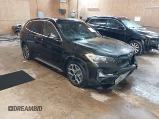 2020 BMW X1 xDrive28i with VIN WBXJG9C07L5P71792, listed as a IAAI auction lot 41583132 with 150,095 mi miles. Bid and sale history available at carsss.com. Image 1.