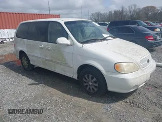 2005 Kia Sedona LX with VIN KNDUP132856700868, listed as a IAAI auction lot 41661428 with 229,142 mi miles. Bid and sale history available at carsss.com. Image 1.
