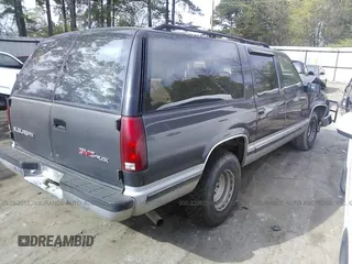 1993 GMC Suburban with VIN 1GKEC16K9PJ754213, listed as a IAAI auction lot 22062516 with 212,780 mi miles. Bid and sale history available at carsss.com. Image 4.