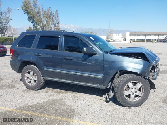 2007 Jeep Grand Cherokee Laredo with VIN 1J8HR48PX7C660601, listed as a IAAI auction lot 41652509 with 131,556 mi miles. Bid and sale history available at carsss.com. Image 14.