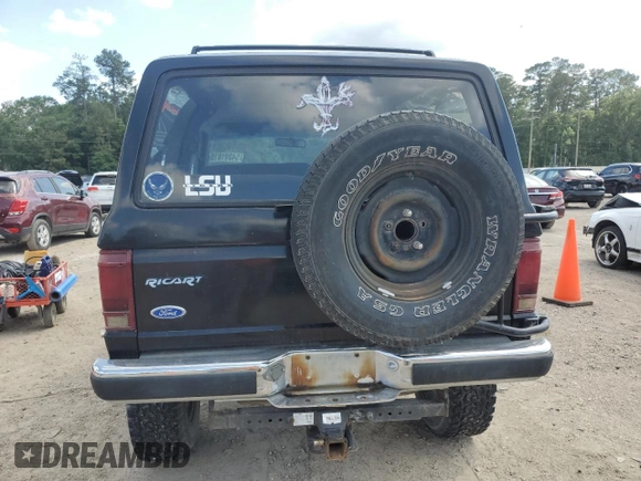 1990 Ford Bronco with VIN 1FMCU14T9LUA15536, listed as a Copart auction lot 54391815 with 319,124 mi miles and Salvage title. Bid and sale history available at DreamBid. Image 6.