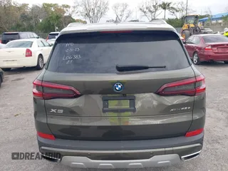 2022 BMW X5 xDrive45e z VIN 5UXTA6C00N9L06383, wystawiony jako IAAI lot #38552162 z przebiegiem 19 592 mil mil oraz . Historia ofert i sprzedaży dostępna na DreamBid. Obrazek 16.