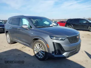 2020 Cadillac XT6 FWD Premium Luxury with VIN 1GYKPCRS8LZ129799, listed as a IAAI auction lot 41602536 with 96,865 mi miles. Bid and sale history available at carsss.com. Image 1.
