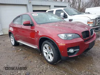 2012 BMW X6 35i z VIN 5UXFG2C54CL779333, wystawiony jako IAAI lot #41483213 z przebiegiem 63 305 mil mil oraz . Historia ofert i sprzedaży dostępna na DreamBid. Obrazek 1.