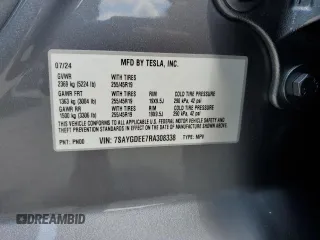 2024 Tesla Model Y Long Range z VIN 7SAYGDEE7RA308338, wystawiony jako Copart lot #61137375 z przebiegiem 19 501 mil mil oraz Szkoda całkowita • Salvage title. Historia ofert i sprzedaży dostępna na DreamBid. Obrazek 12.
