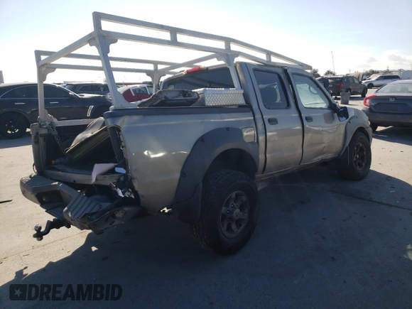 2002 Nissan Frontier SE with VIN 1N6ED27T52C383700, listed as a Copart auction lot 86204074 with 216,908 mi miles and Salvage title. Bid and sale history available at DreamBid. Image 3.