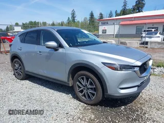 2018 Mazda CX-5 Grand Touring z VIN JM3KFADM7J0318684, wystawiony jako IAAI lot #42226937 z przebiegiem 69 166 mil mil oraz . Historia ofert i sprzedaży dostępna na DreamBid. Obrazek 1.