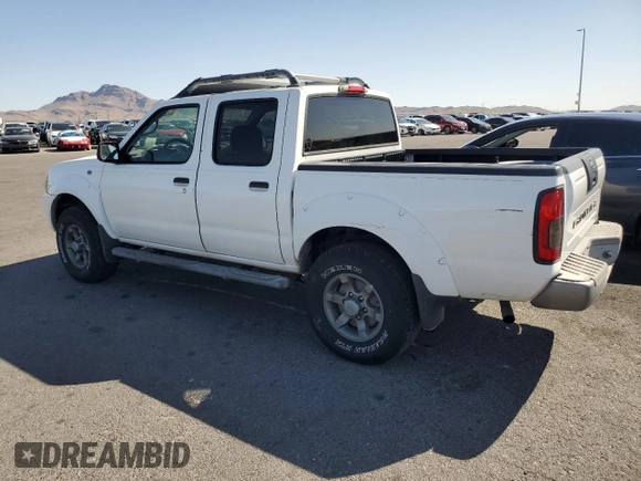 2004 Nissan Frontier XE z VIN 1N6ED27T44C450726, wystawiony jako Copart lot #57004045 z przebiegiem 151 638 mil mil oraz Szkoda całkowita • Salvage title. Historia ofert i sprzedaży dostępna na DreamBid. Obrazek 2.