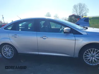 2014 Ford Focus Titanium with VIN 1FADP3J28EL354505, listed as a IAAI auction lot 42025966 with 104,868 mi miles. Bid and sale history available at carsss.com. Image 14.