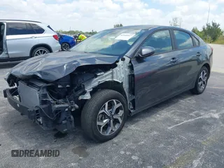 2021 Kia Forte LXS with VIN 3KPF24AD1ME353955, listed as a IAAI auction lot 42160127 with 61,719 mi miles. Bid and sale history available at carsss.com. Image 2.