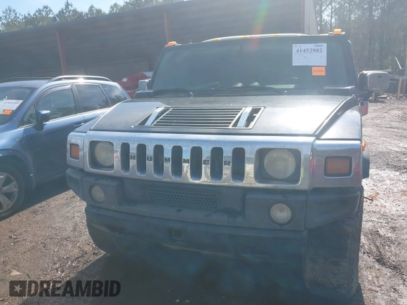 2003 Hummer H2 with VIN 5GRGN23U33H144379, listed as a IAAI auction lot 41452982 with 227,746 mi miles. Bid and sale history available at carsss.com. Image 12.