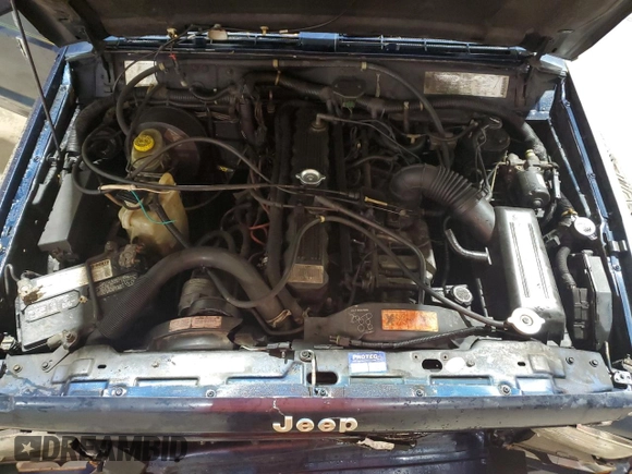 1995 Jeep Cherokee z VIN 1J4FN78S7SL537213, wystawiony jako Copart lot #58700105 z przebiegiem 261 606 mil mil oraz Szkoda całkowita • Salvage title. Historia ofert i sprzedaży dostępna na DreamBid. Obrazek 11.