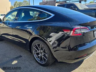 2018 Tesla Model 3 Long Range Battery with VIN 5YJ3E1EA0JF173302, listed as a Copart auction lot 54197265 with 59,956 mi miles and Salvage Title. Bid and sale history available at carsss.com. Image 3.