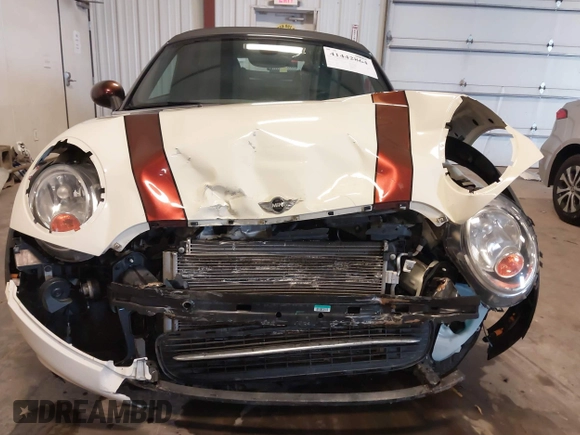 2013 MINI Roadster with VIN WMWSY1C52DT625564, listed as a IAAI auction lot 41442864 with 98,240 mi miles and . Bid and sale history available at DreamBid. Image 6.
