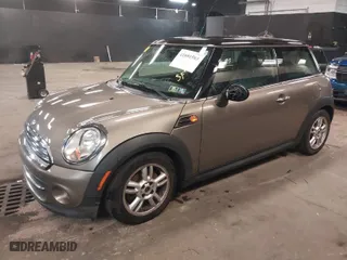2013 MINI Cooper Hardtop with VIN WMWSU3C55DT679450, listed as a IAAI auction lot 41891583 with 106,410 mi miles. Bid and sale history available at carsss.com. Image 2.