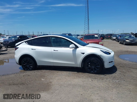 2023 Tesla Model Y Long Range z VIN 7SAYGDEE9PF753051, wystawiony jako IAAI lot #39615839 z przebiegiem Nie podano mil oraz . Historia ofert i sprzedaży dostępna na DreamBid. Obrazek 12.
