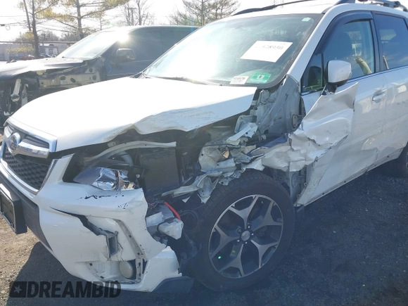 2014 Subaru Forester XT Touring with VIN JF2SJGMC4EH534647, listed as a IAAI auction lot 41828950 with 106,375 mi miles and . Bid and sale history available at DreamBid. Image 6.