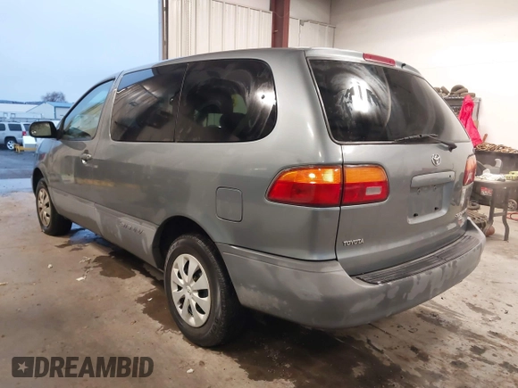 1999 Toyota Sienna CE with VIN 4T3GF19C5XU139787, listed as a IAAI auction lot 41167781 with 217,715 mi miles. Bid and sale history available at carsss.com. Image 3.