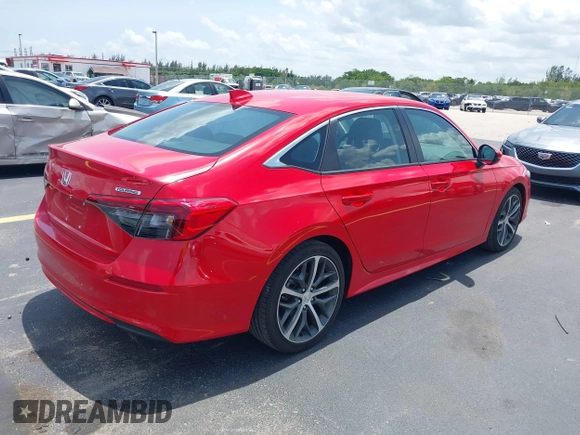 2023 Honda Civic Touring with VIN 2HGFE1F94PH323451, listed as a IAAI auction lot 42383422 with 6,120 mi miles and . Bid and sale history available at DreamBid. Image 4.