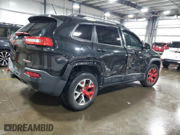 2015 Jeep Cherokee Trailhawk with VIN 1C4PJMBS5FW587545, listed as a Copart auction lot 58820685 with 136,755 mi miles and Salvage title. Bid and sale history available at DreamBid. Image 3.