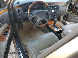 2000 Infiniti Q45 z VIN JNKBY31A0YM301297, wystawiony jako Copart lot #74672884 z przebiegiem 171 263 mil mil oraz Szkody całkowita. Historia ofert i sprzedaży dostępna na DreamBid. Obrazek 8.