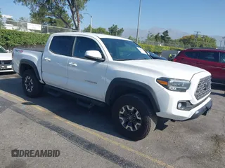 2023 Toyota Tacoma SR with VIN 3TMCZ5AN1PM574799, listed as a IAAI auction lot 42497964 with 21,183 mi miles and . Bid and sale history available at DreamBid. Image 1.
