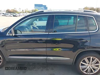 2015 Volkswagen Tiguan SE with VIN WVGAV7AX5FW509612, listed as a IAAI auction lot 42020599 with 64,201 mi miles and . Bid and sale history available at DreamBid. Image 14.