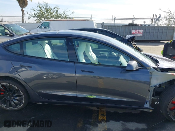 2023 Tesla Model 3 Performance with VIN 5YJ3E1EC4PF705449, listed as a IAAI auction lot 41587026 with 30,292 mi miles. Bid and sale history available at carsss.com. Image 14.