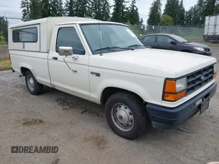 1990 Ford Ranger z VIN 1FTCR10T2LUB33410, wystawiony jako IAAI lot #42495111 z przebiegiem 32 930 mil mil oraz . Historia ofert i sprzedaży dostępna na DreamBid. Obrazek 1.