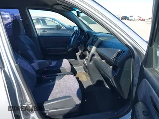 2002 Honda CR-V LX with VIN JHLRD68432C019992, listed as a IAAI auction lot 41963062 with 154,917 mi miles and . Bid and sale history available at carsss.com. Image 5.