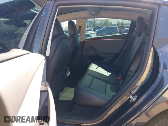 2024 Tesla Model 3 with VIN 5YJ3E1EA9RF849936, listed as a IAAI auction lot 41707656 with 18,749 mi miles and . Bid and sale history available at DreamBid. Image 8.