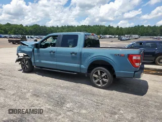 2023 Ford F-150 XL with VIN 1FTEW1CP7PKD02399, listed as a Copart auction lot 60738155 with 23,059 mi miles and Salvage title. Bid and sale history available at DreamBid. Image 2.
