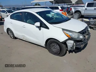 2014 Kia Rio LX with VIN KNADM4A30E6370761, listed as a IAAI auction lot 42097075 with 126,752 mi miles. Bid and sale history available at carsss.com. Image 1.