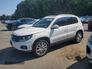 2013 Volkswagen Tiguan SEL with VIN WVGBV3AXXDW588446, listed as a Copart auction lot 63568195 with 103,566 mi miles and Salvage title. Bid and sale history available at DreamBid. Image 1.