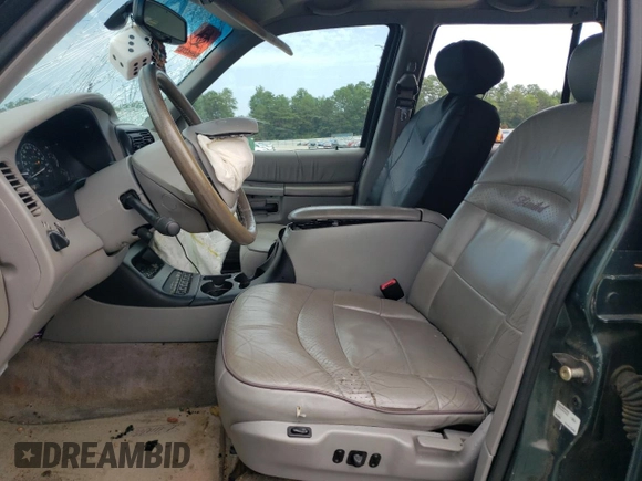 1998 Ford Explorer XLT with VIN 1FMZU32P8WZA91509, listed as a Copart auction lot 65531174 with 127,182 mi miles and Salvage title. Bid and sale history available at DreamBid. Image 7.