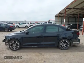 2016 Volkswagen Jetta Sport z VIN 3VWD17AJ0GM409795, wystawiony jako IAAI lot #41773028 z przebiegiem 147 979 mil mil oraz . Historia ofert i sprzedaży dostępna na DreamBid. Obrazek 14.