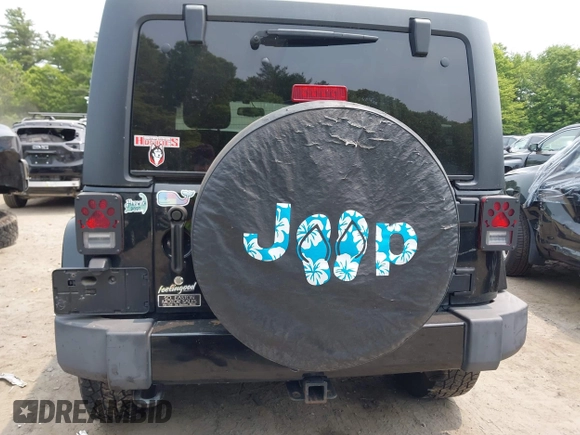 2015 Jeep Wrangler Unlimited Sahara with VIN 1C4HJWEG3FL661568, listed as a IAAI auction lot 42387810 with 140,927 mi miles and . Bid and sale history available at DreamBid. Image 16.