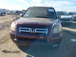 2007 Honda Pilot EX-L with VIN 2HKYF18677H524713, listed as a IAAI auction lot 41345312 with 169,957 mi miles and . Bid and sale history available at DreamBid. Image 6.