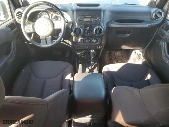 2014 Jeep Wrangler Unlimited Sport with VIN 1C4BJWDG8EL134356, listed as a Copart auction lot 74378874 with 103,318 mi miles and Salvage Title. Bid and sale history available at carsss.com. Image 8.