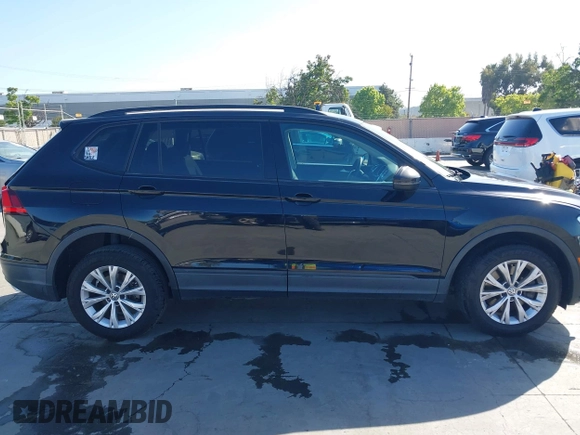 2018 Volkswagen Tiguan S with VIN 3VV1B7AX1JM091928, listed as a IAAI auction lot 42283454 with 53,650 mi miles and . Bid and sale history available at DreamBid. Image 13.