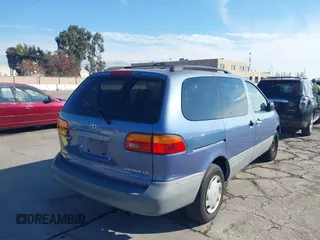 1999 Toyota Sienna LE with VIN 4T3ZF13C2XU126738, listed as a IAAI auction lot 41012127 with 218,080 mi miles. Bid and sale history available at carsss.com. Image 4.