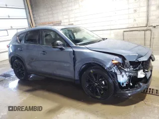 2024 Mazda CX-5 S Carbon Edition z VIN JM3KFBCL2R0528359, wystawiony jako Copart lot #58007515 z przebiegiem 20 743 mil mil oraz Tytuł czysty. Historia ofert i sprzedaży dostępna na DreamBid. Obrazek 4.