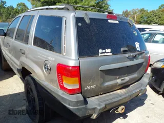 1999 Jeep Grand Cherokee Laredo with VIN 1J4GW58S0XC678864, listed as a IAAI auction lot 37593033 with Not provided miles and . Bid and sale history available at DreamBid. Image 3.